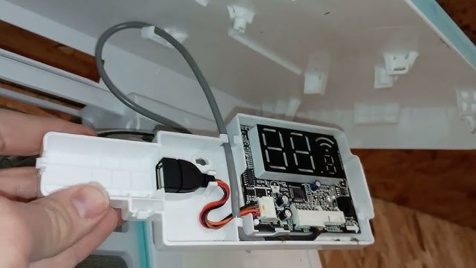 MrCool WMK-19 Smart WiFi Controller installed on ductless mini-split air handler — plug-and-play installation for remote operation through SmartHVAC app and MRCOOL DIY systems.