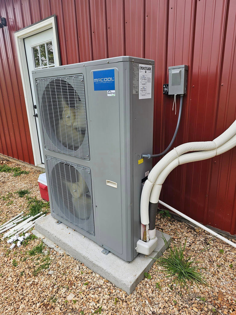 MRCOOL outdoor heat pump beside a building