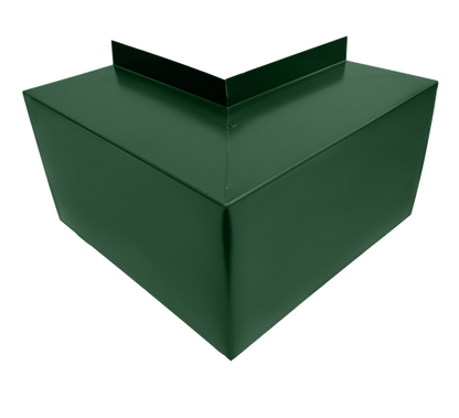 A green metal object with sharp edges and a triangular protrusion on top, resembling an industrial or architectural component made from Commercial Series - 24 Gauge Line Set Cover Outside Corner Elbows - Premium Quality by Perma Cover. The object is shown on a white background.