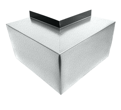 A three-dimensional geometric shape resembling a corner with two intersecting metal panels forming a right angle. Each panel has a metallic, textured surface and a smooth edge, offering simple and easy installation. The background is white and clean. This product is the Residential Series - Line Set Cover Outside Corner Elbows - Premium Quality by Perma Cover.