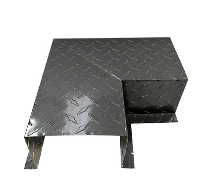 A sturdy metal platform with a textured diamond plate pattern. It has a step design with a lower and upper level, supported by solid legs for easy installation. The reflective structure appears durable, suitable for industrial or heavy-duty use, ensuring it meets Perma Cover Residential Series - Line Set Cover Side Turning Elbows - Premium Quality standards.