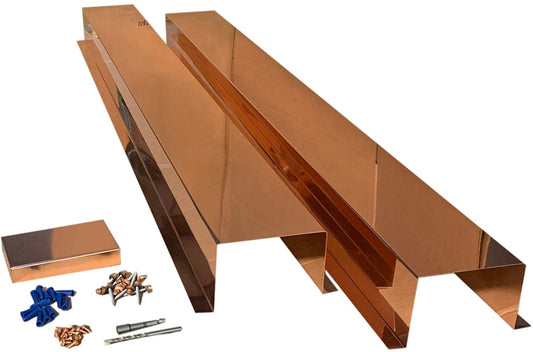 A set of Perma Cover Residential Series - Copper Metal HVAC Line Set Covers - Pure Copper with mounting hardware, including screws, drill bit, and wall anchors. The 16-ounce 24-gauge covers are reflective copper with a sleek, polished finish. The hardware components are neatly arranged next to the covers.
