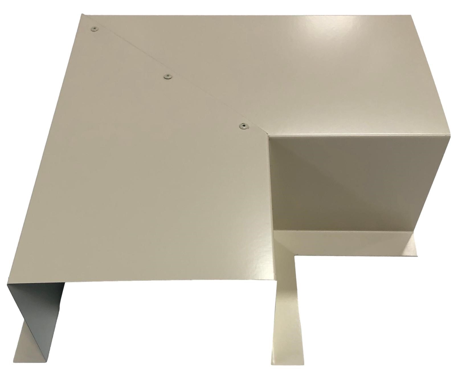 A metallic, cream-colored L-shaped bracket is displayed against a white background. The Perma Cover Residential Series - Line Set Cover Side Turning Elbows - Premium Quality has a few screws visible and features a raised section on one side, likely for mounting or structural support, ensuring easy installation.