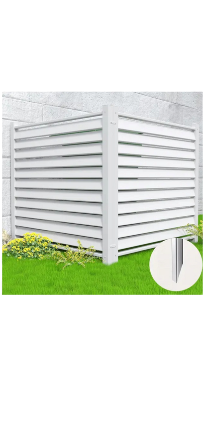 A white louvered enclosure, serving as a Condenser Fence product called Privacy Shield Fence Panels - Hide Unsightly Outdoor Equipment with Ease, is set up on a lush green lawn near a concrete wall. Yellow flowers and bushes bloom at its base. An inset close-up shows the corner details of the weather-resistant slats and support structure.