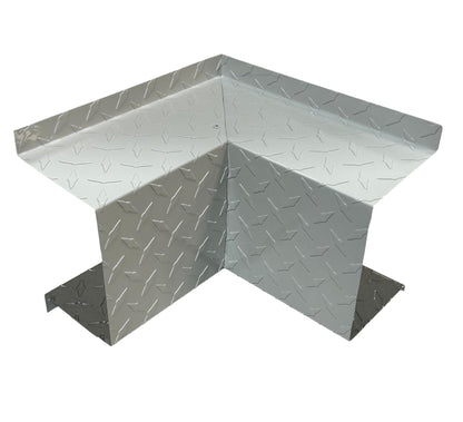 A Perma Cover Residential Series - Line Set Cover Inside Corner Elbows - Premium Quality, ideal for HVAC installations. It is designed to protect walls and corners from damage. The guard has a shiny, reflective surface with a textured, raised diamond design.
