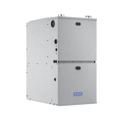 An image of the Mr Cool MRCOOL VersaPro 120k BTU 96% AFUE Gas Furnace, MGM96EE120D5NB. It is a silver, rectangular HVAC unit with a vertical orientation and a two-section design featuring a small access panel in the lower section. Various circular connection points are visible on the side. This gas furnace boasts a two-stage motor and exceptional 96% AFUE efficiency, with its logo and text displayed on a label at the bottom.