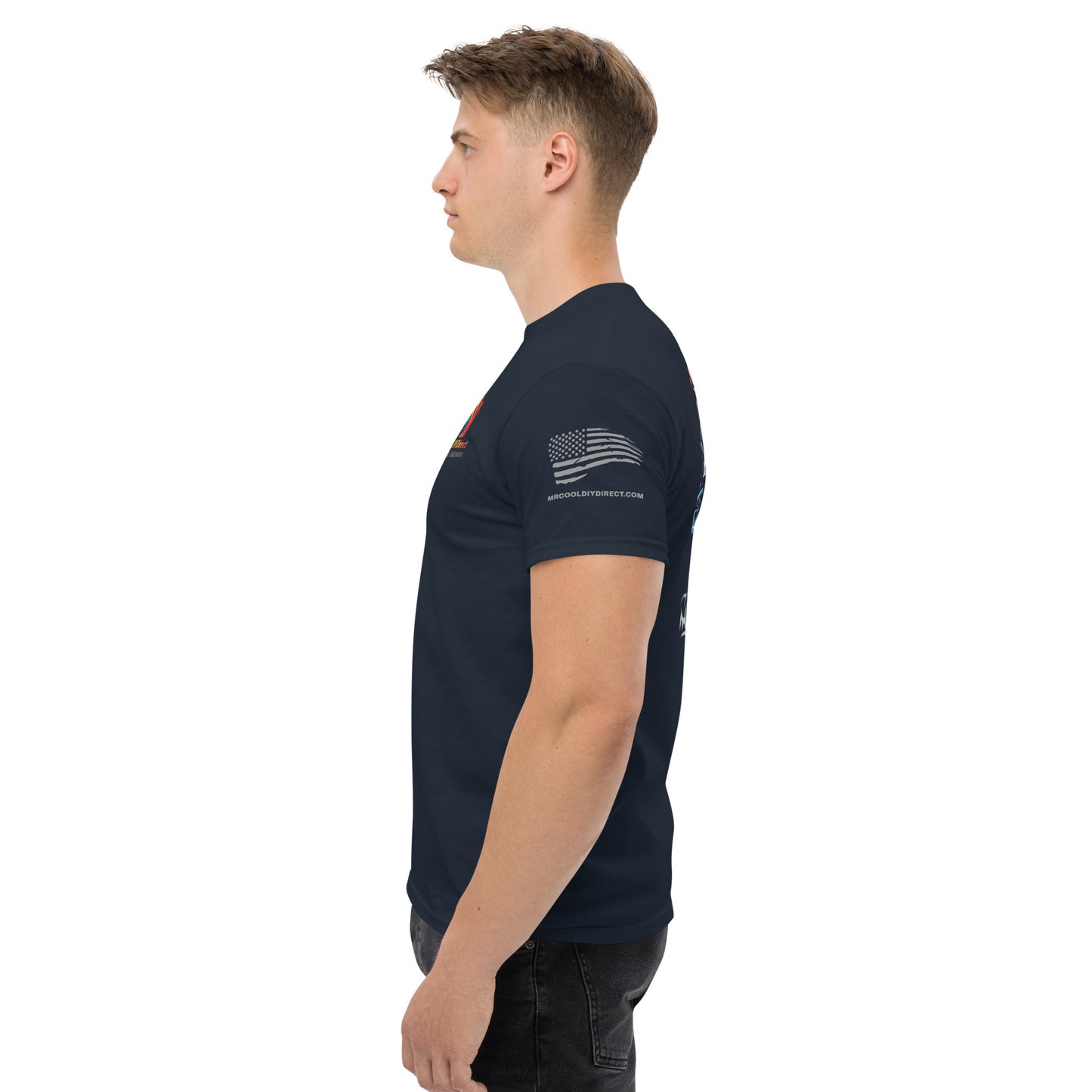 A young man in a navy blue t-shirt, profile view, with Exclusive HVAC-Themed Custom Tees by MRCOOL DIY Direct and text on the sleeve, standing against a white background.