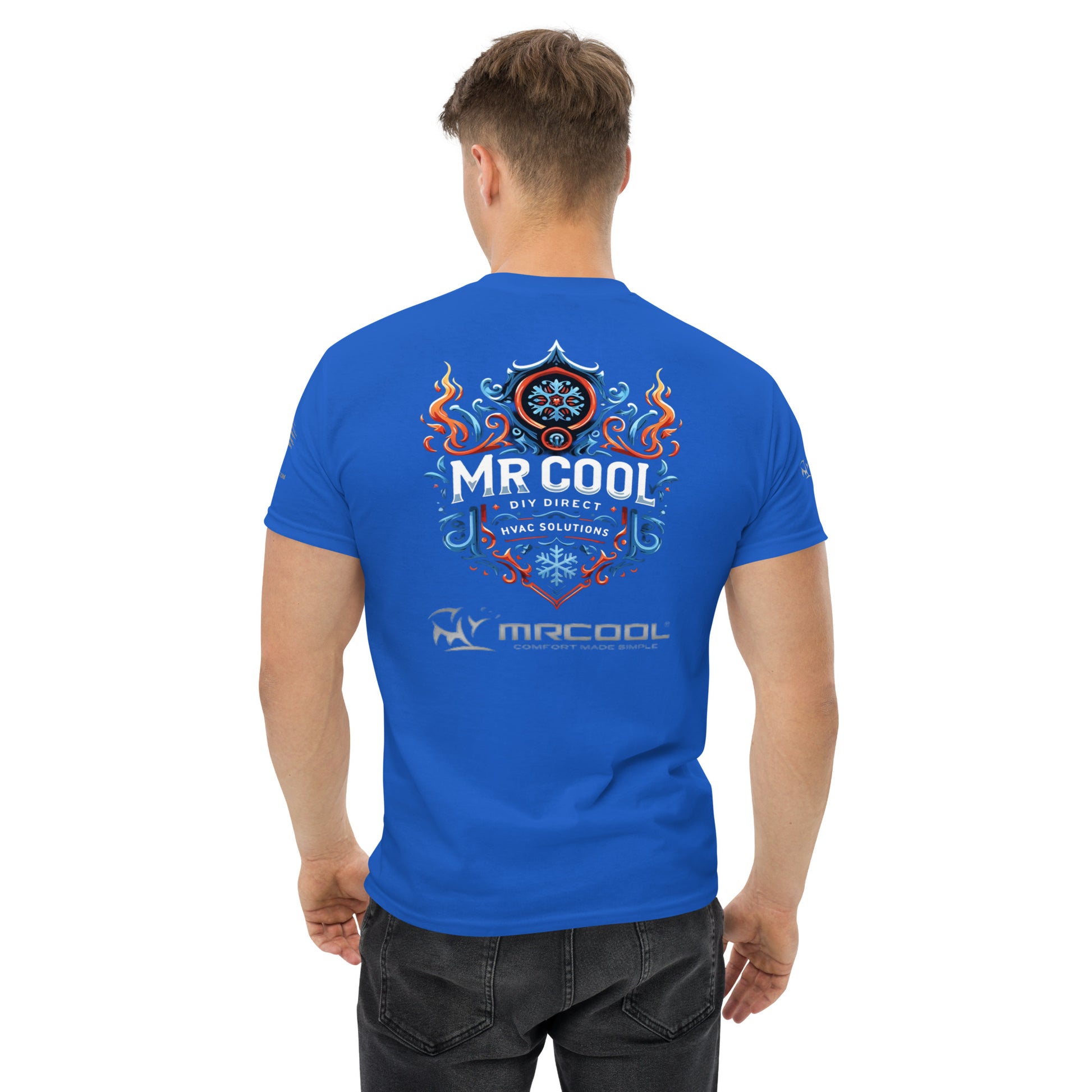A man viewed from behind wearing a bright blue t-shirt with "Exclusive HVAC-Themed Custom Tees - MRCOOL DIY Direct" printed in graphic style, featuring flames and a circular emblem by The Salty Medic.