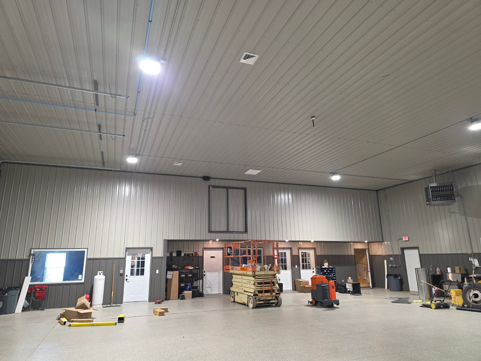 Large commercial workshop conditioned with a 5 Ton MRCOOL heat pump package system featuring propane backup heat for dependable year-round comfort.