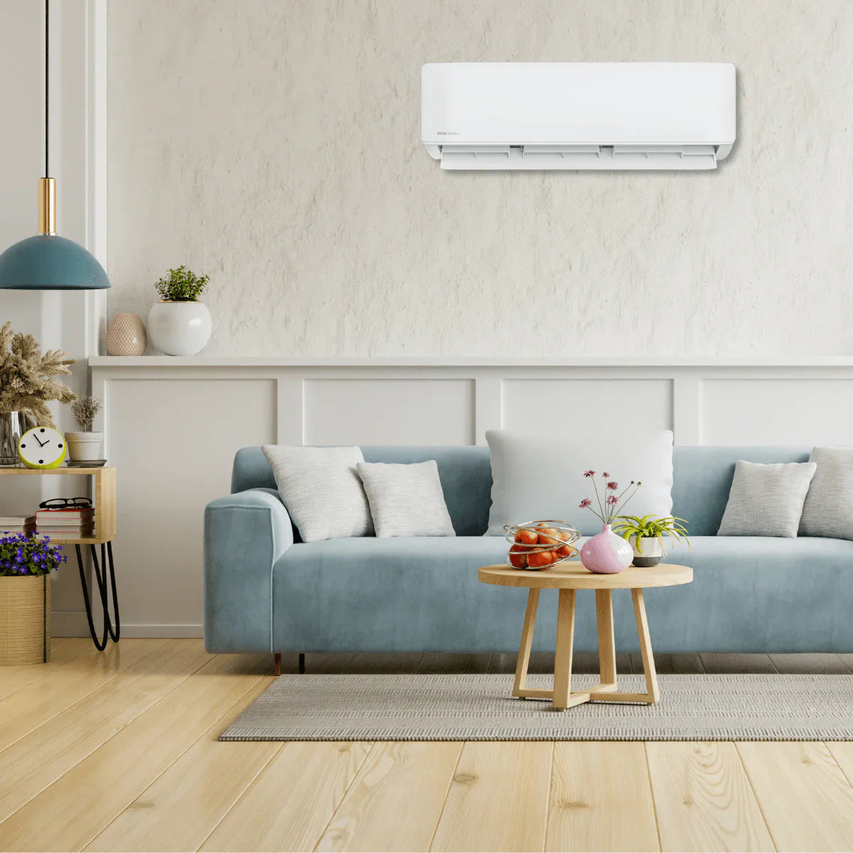 MRCOOL DIY 12K Hyper Heat wall mounted mini split installed above sofa in modern living room providing heating and cooling