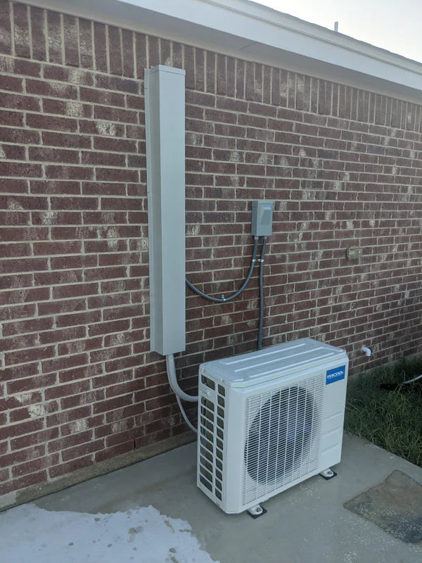 Metal line set covers installed on a heat pump HVAC system