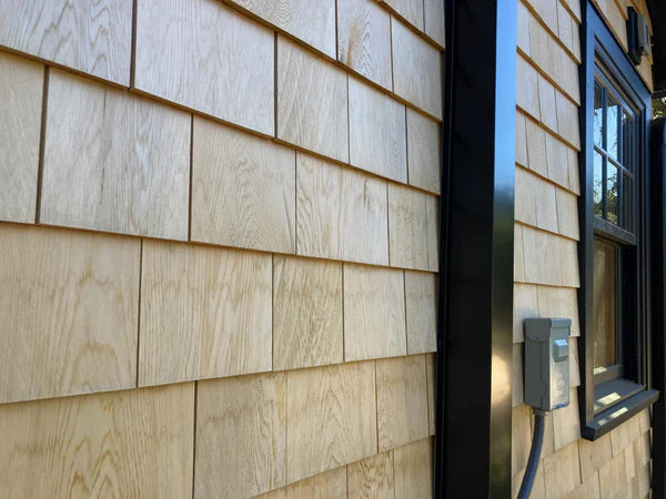 Exposed HVAC refrigerant lines before installing PermaCover metal line set covers
