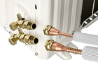 MRCOOL R-454B No-Vac Line Set installed with Universal 2nd Gen heat pump and Cased A-Coil, showing quick-connect fittings and secure DIY coupler attachment