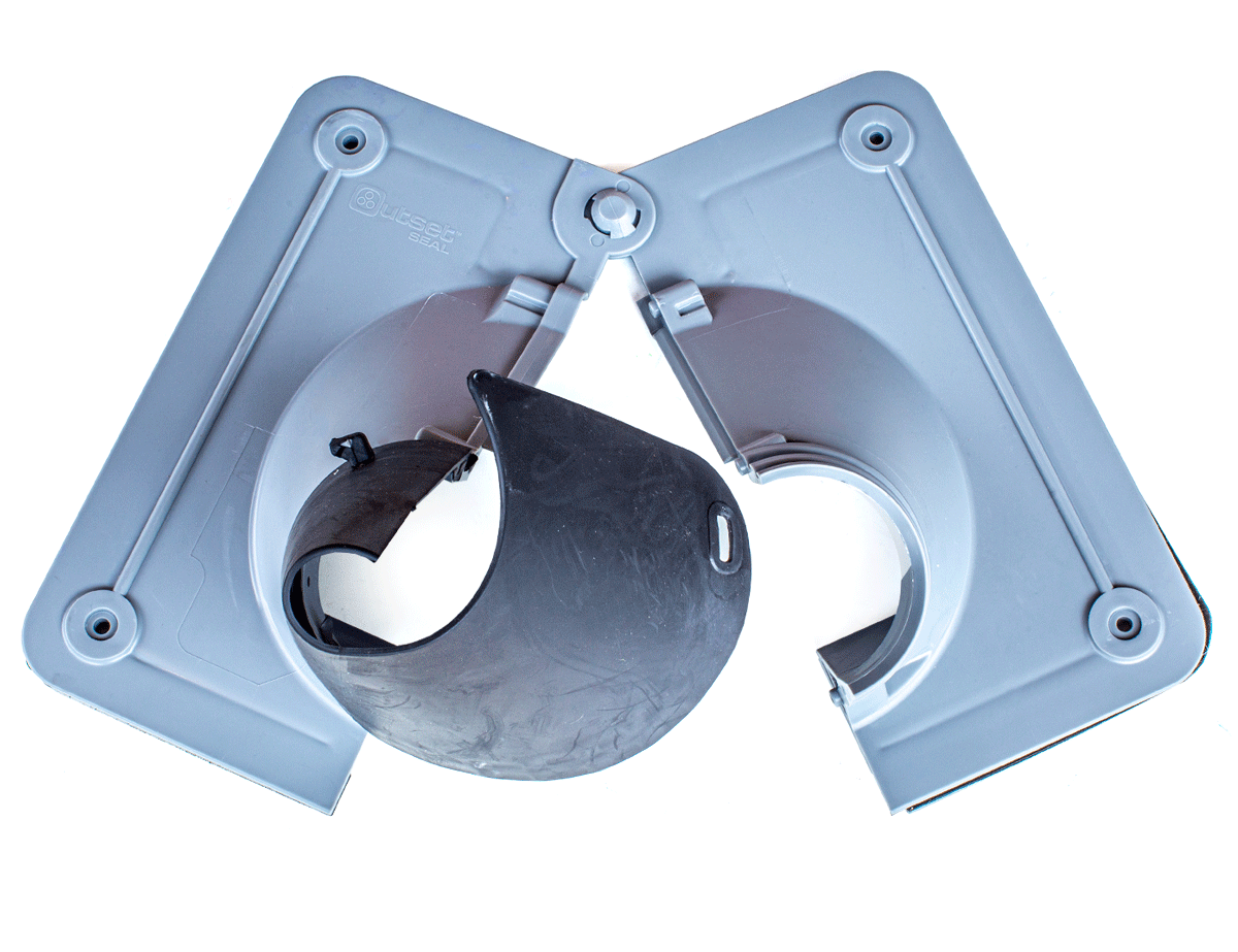 Hinged split design of the RectorSeal Outset Seal showing easy installation around existing HVAC line sets