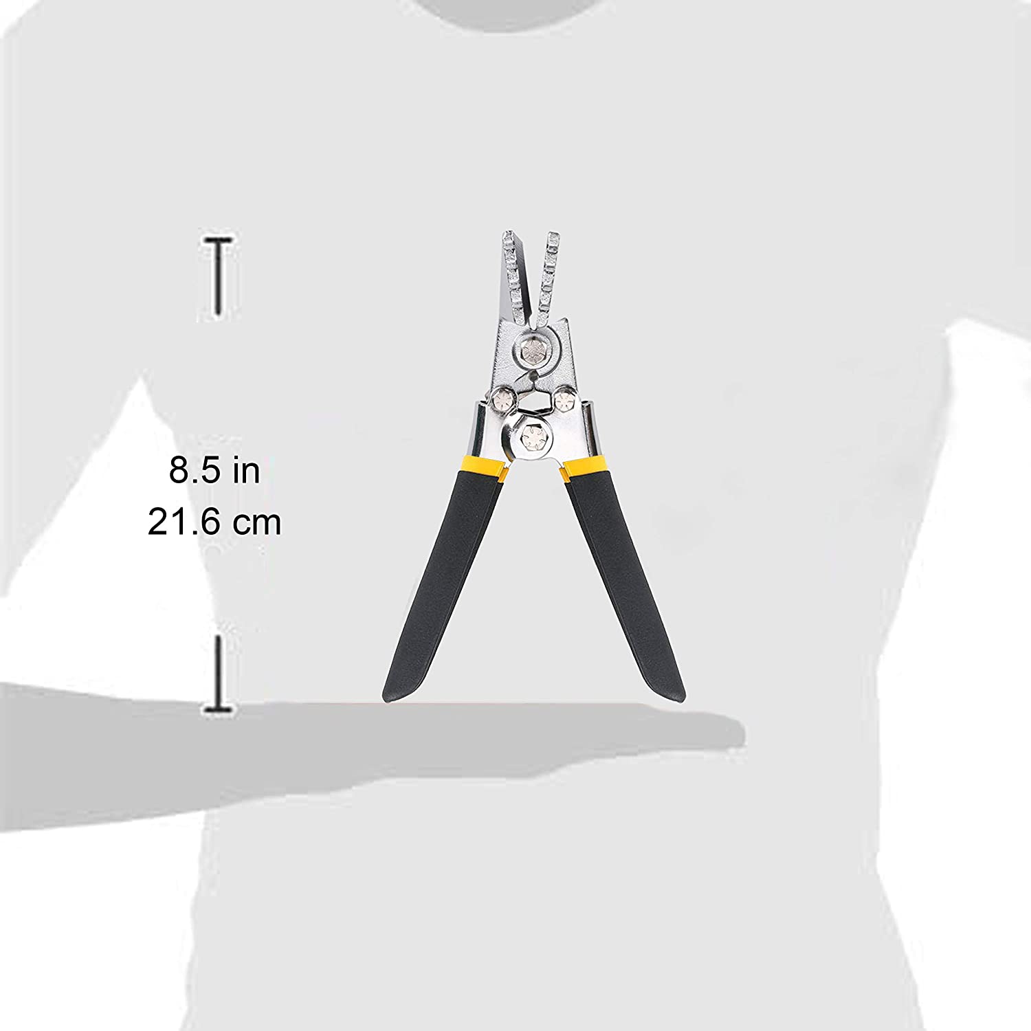 A person holding a pair of Perma Cover High Quality Sheet Metal Hand Seamers - Multiple Sizes Available, with black and yellow handles, measuring 8.5 inches (21.6 cm) in length. The image highlights the dimensions next to the tool, which could also be ideal for bending seaming flattening tasks in sheet metal work.